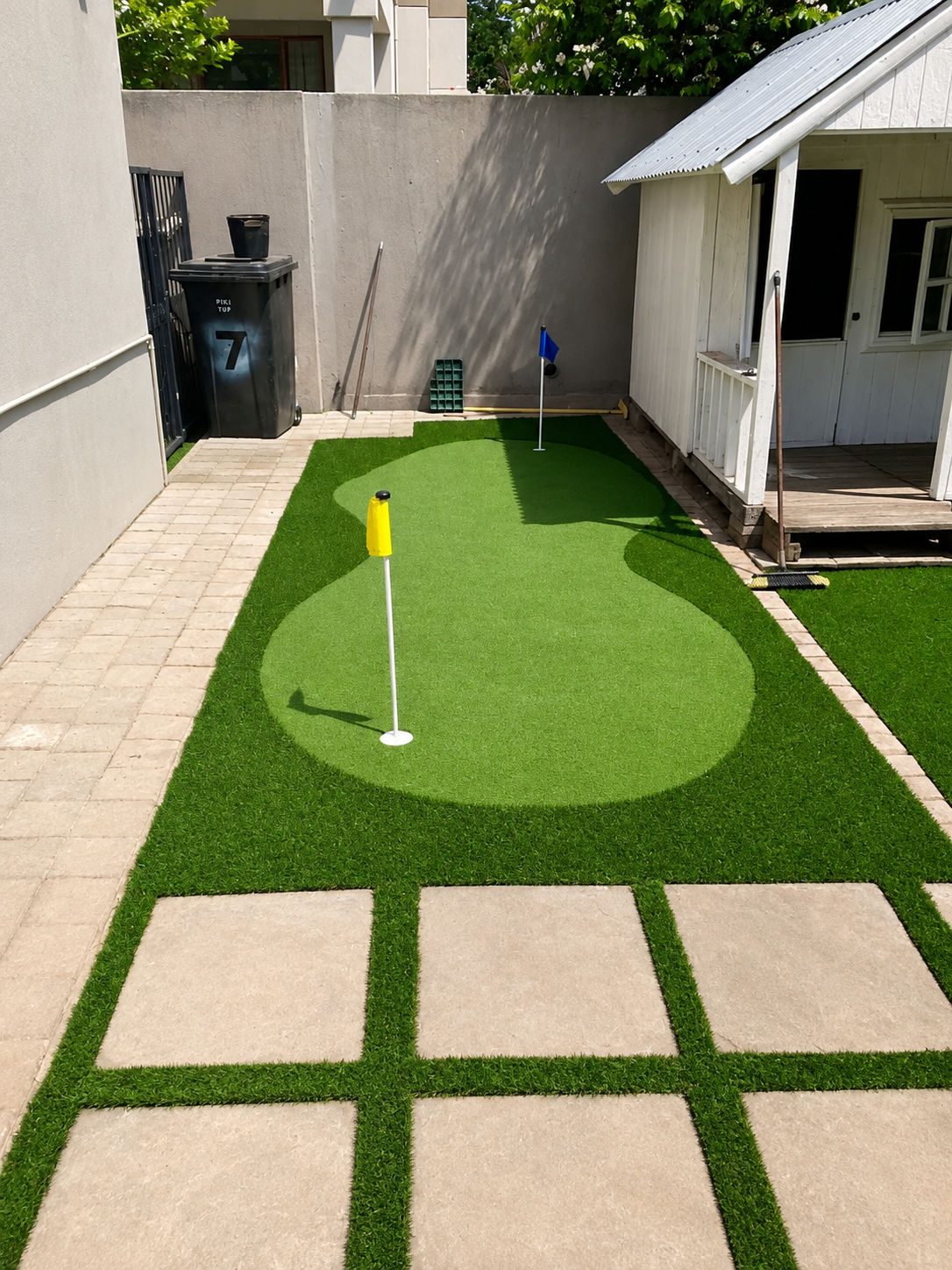 sunlit backyard putting green